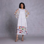 Boat neck dress with side pockets and fluid silhouette
