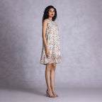 Sleeveless dress with layered ruffle accents
