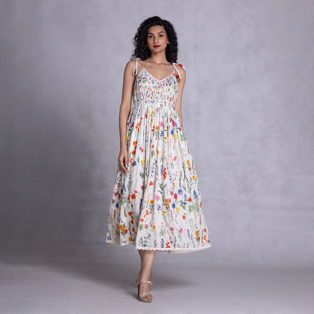 Cambric dress with tie-up straps and relaxed fit